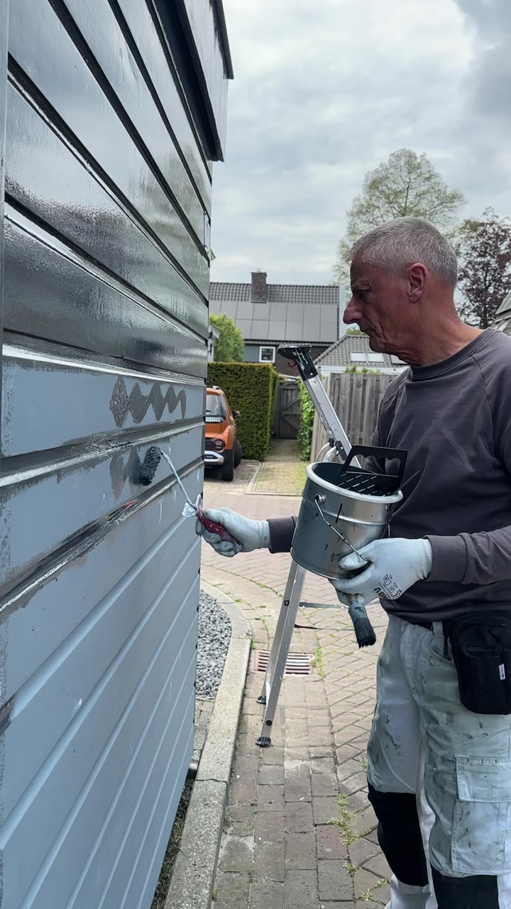 Ron painting slate cladding