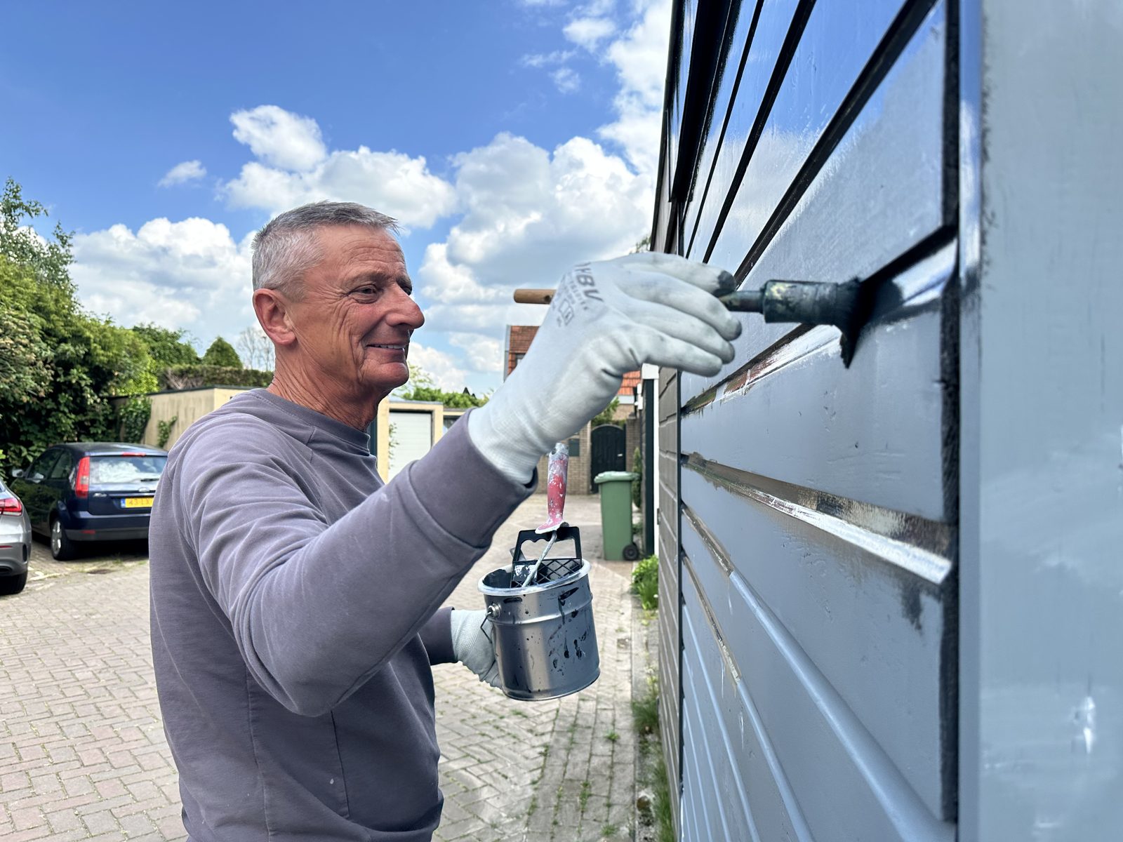 Ron painting the cladding himself